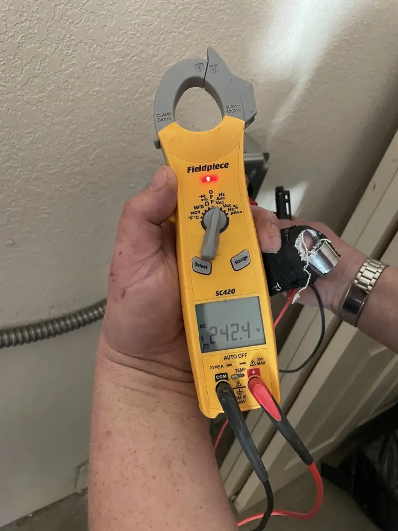 Voltage testing with clamp meter during Recessed Lighting Installation in Chester
